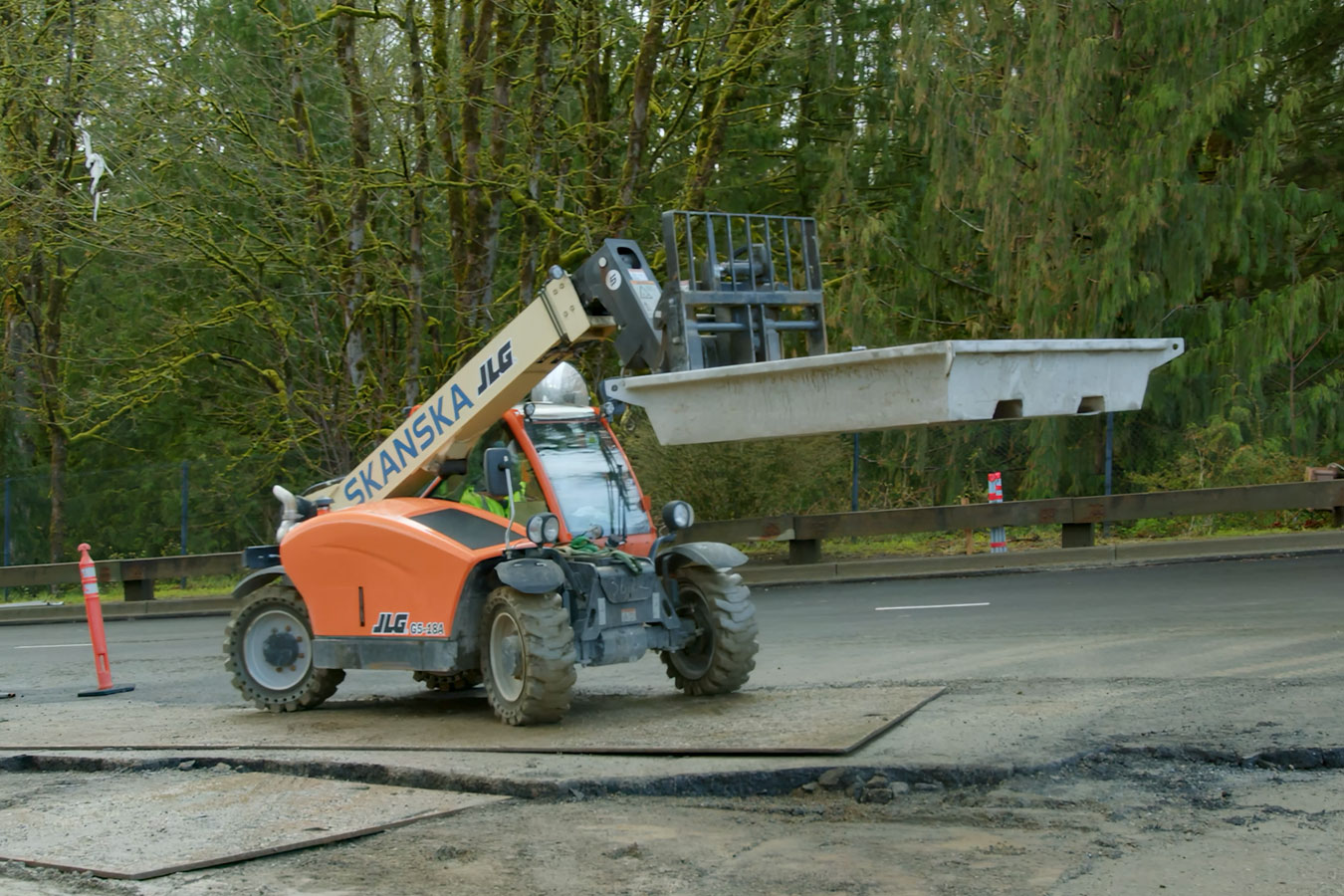 Forklift moving washout pan